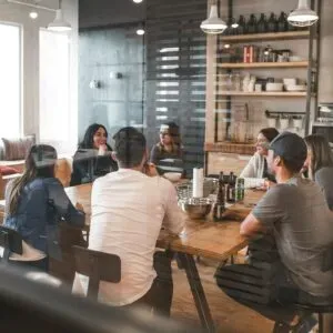A group talking together around a table