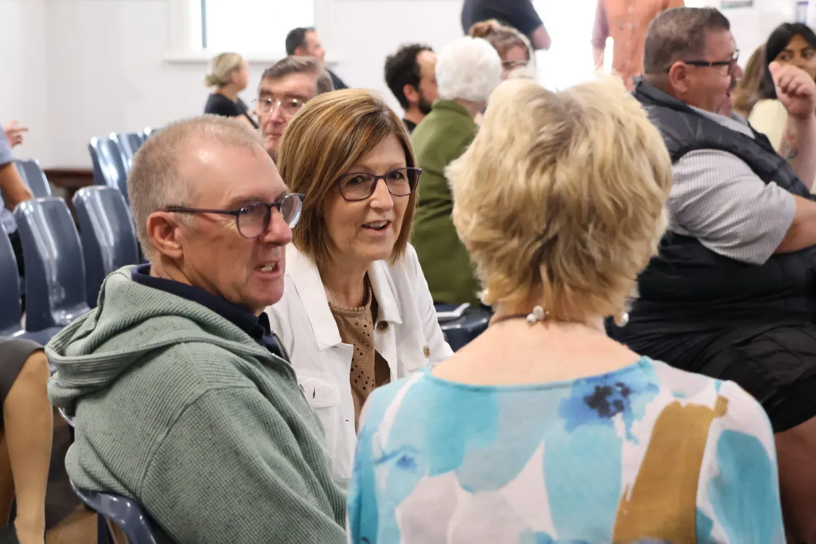Church members talking together at a Sunday service