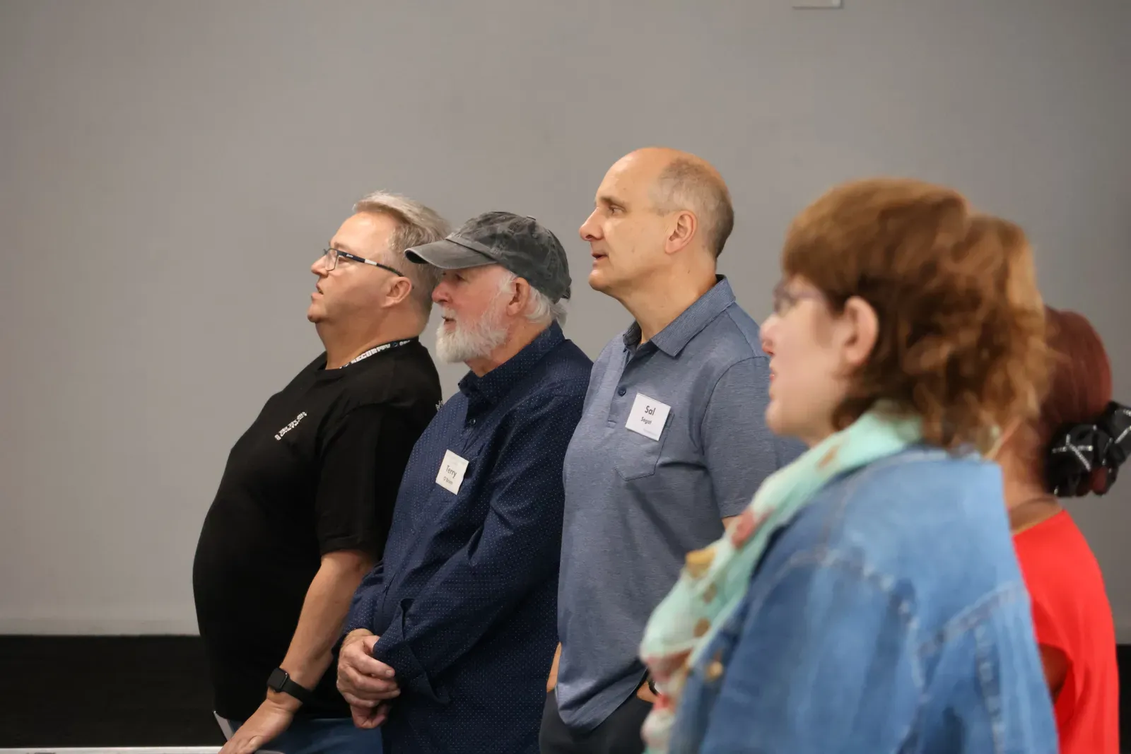 Members of the congregation standing to sing at Clyde Public Hall