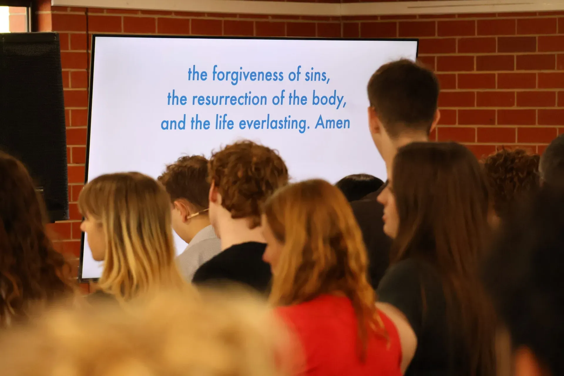 The congregation saying the Apostles' Creed together at a Sunday church service in Clyde