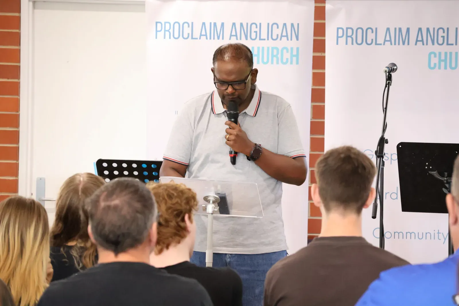 A Bible reading at the front of the church during a Sunday service in Clyde